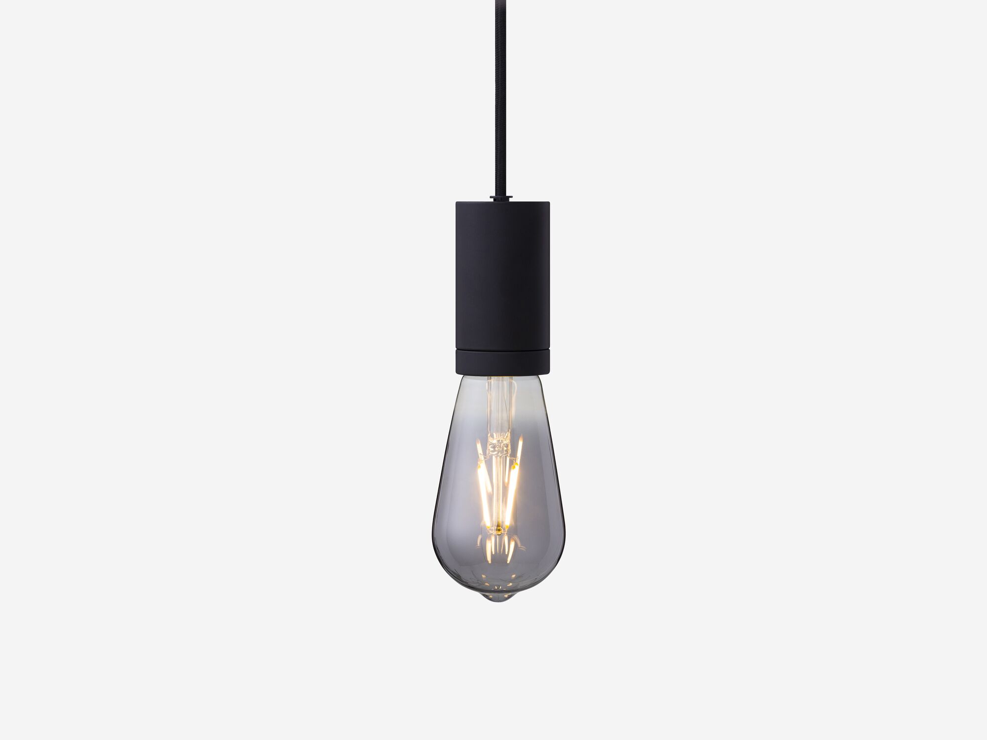 Medium smoked grey lightbulb hanging from black hardware front view